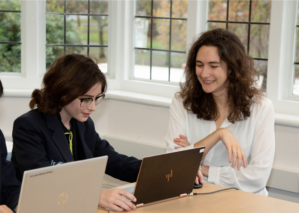 student working with her teacher
