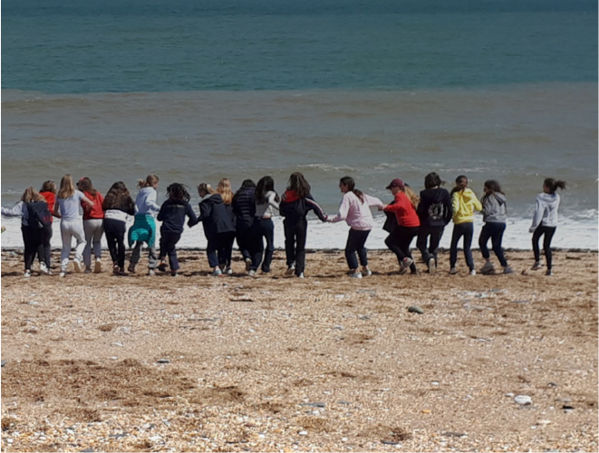 students at the beach