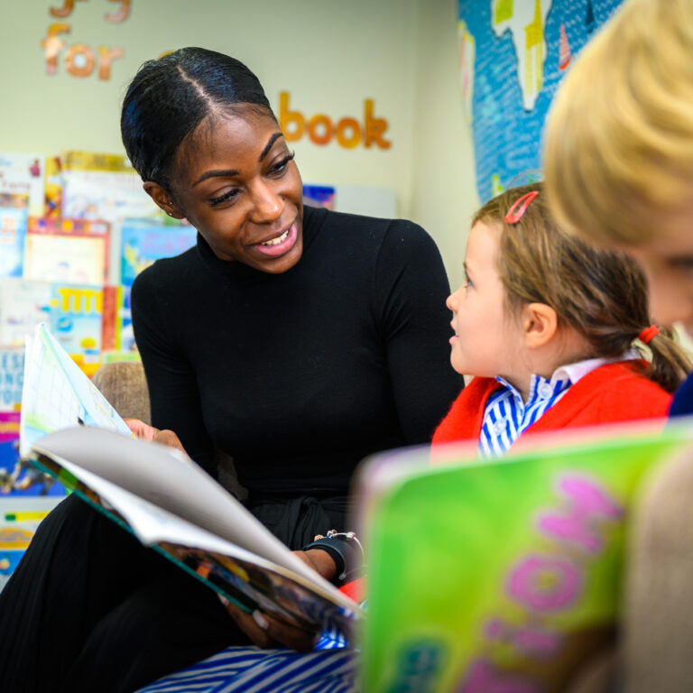 teacher reading to her student