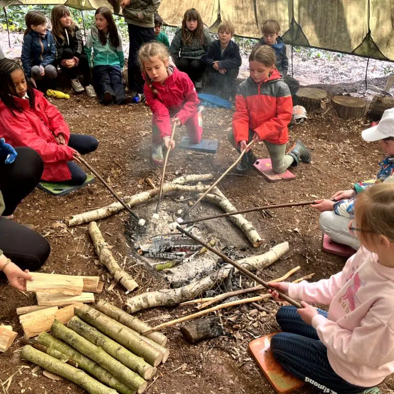 students roasting marshmallows