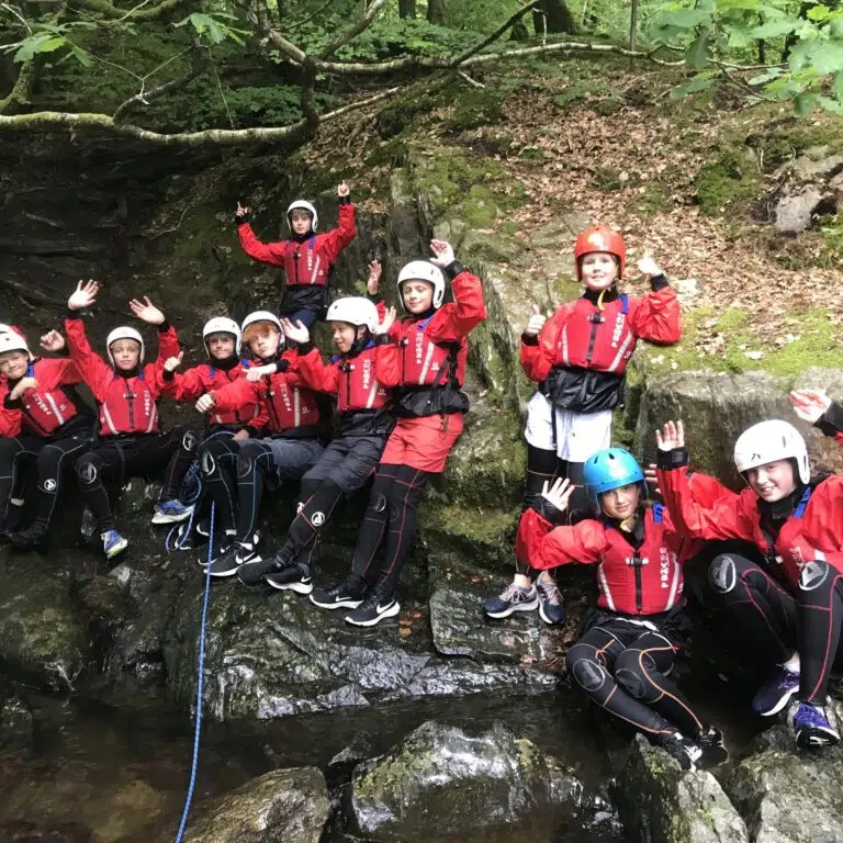 students in rock climbing gear