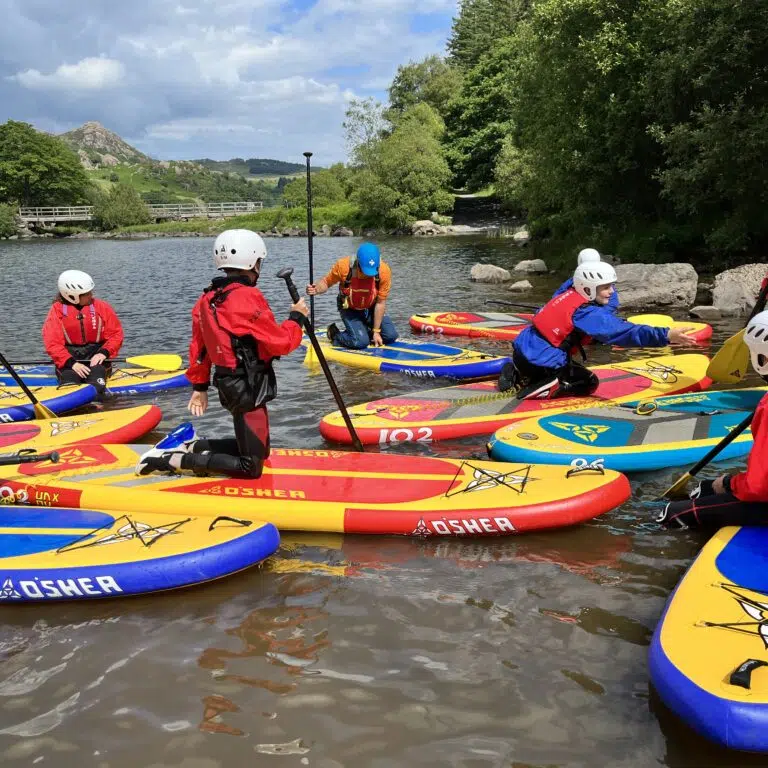 students on rafts