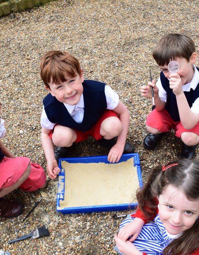 pupils playing with sand