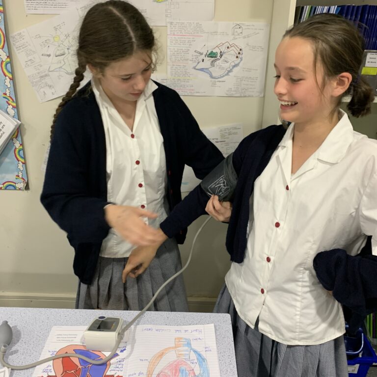 student having blood pressure taken