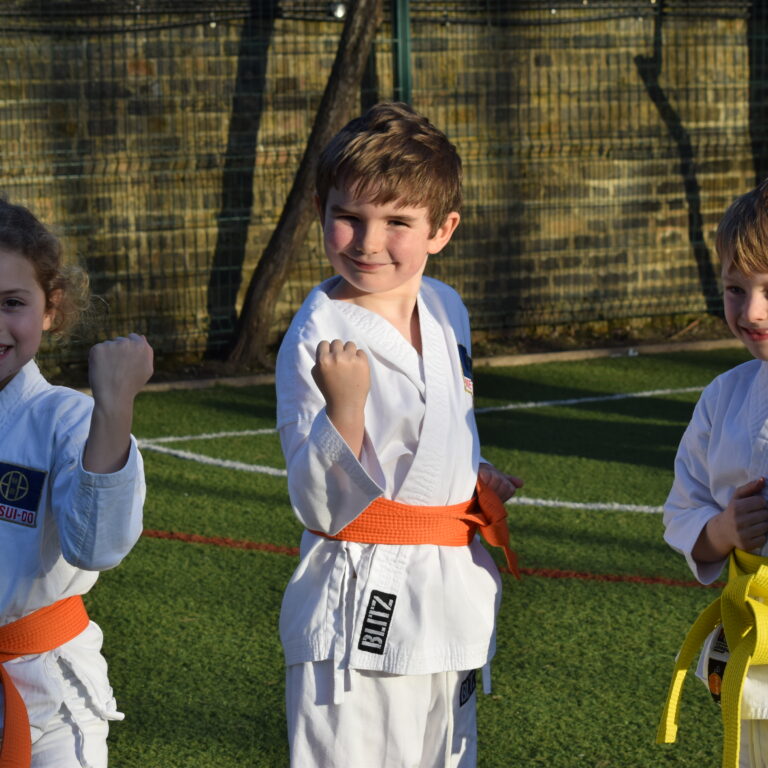 students with martial art clothing on