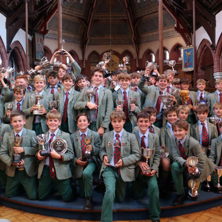 boys holding trophies