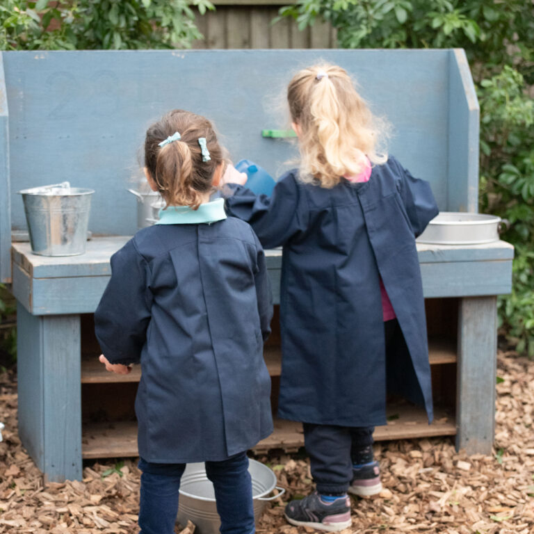 students using a mud kitchen