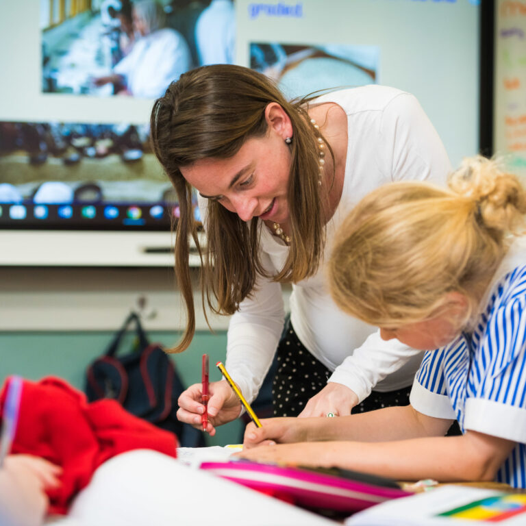 student with her teacher