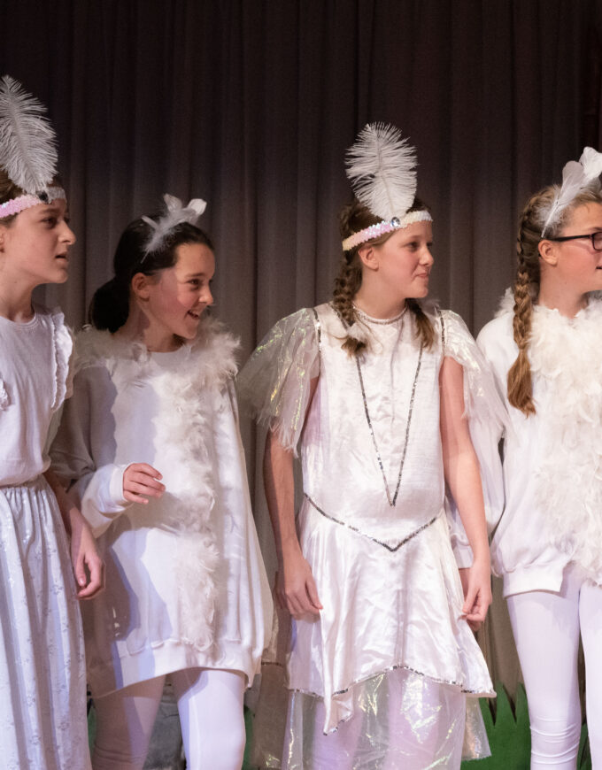 students dressed in white clothes