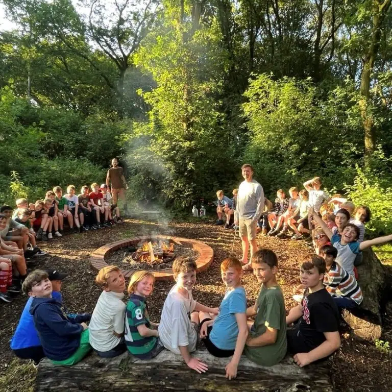 students around a campfire