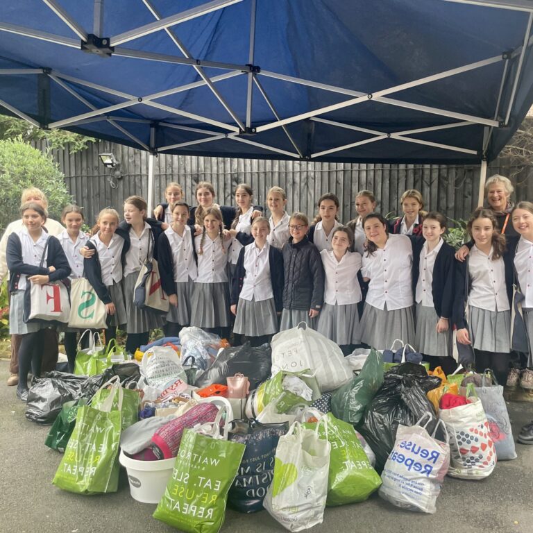 students with bags for charity donation