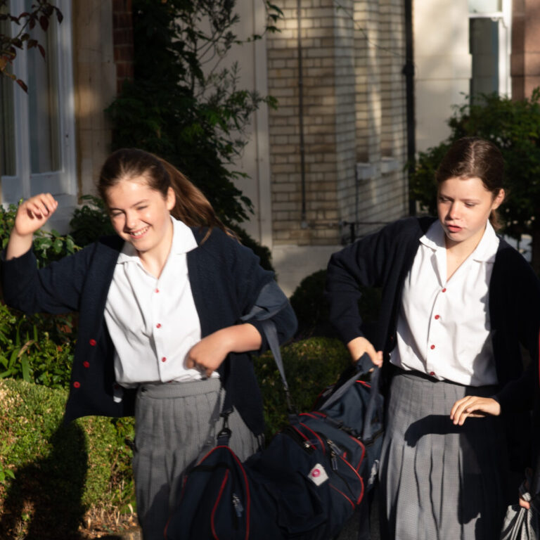 3 girls walking to school