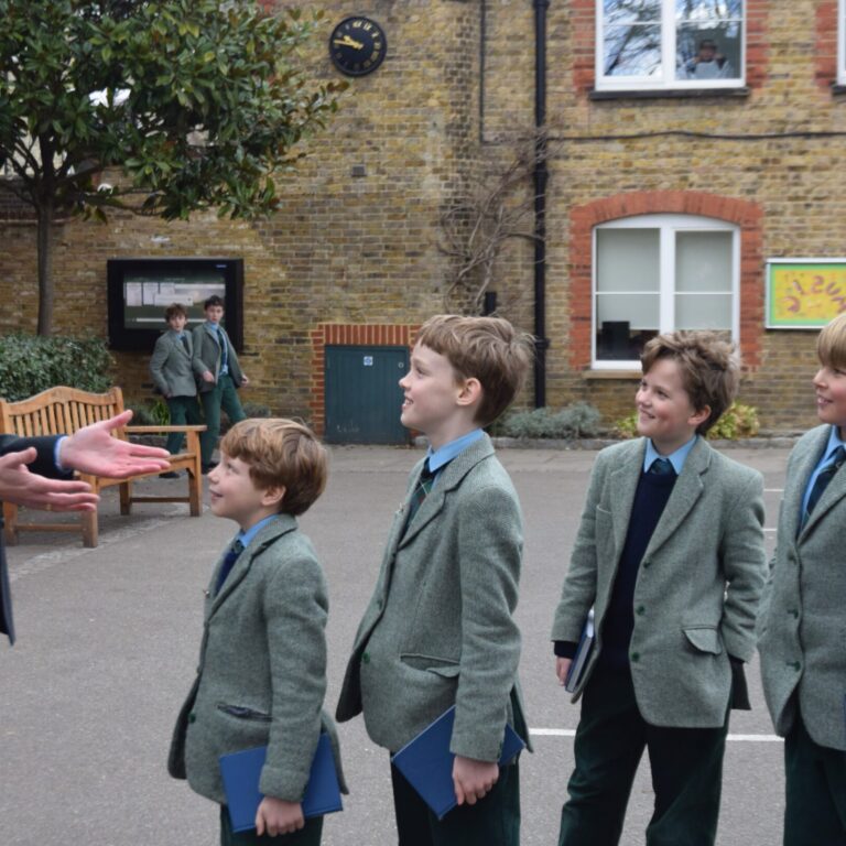 teacher talking to 5 boys