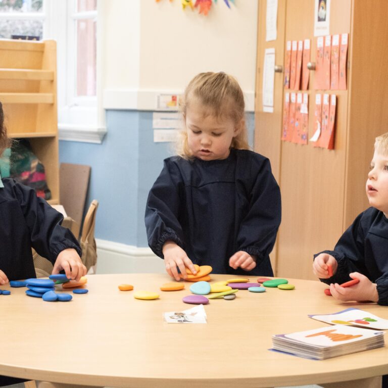 students playing at their desk