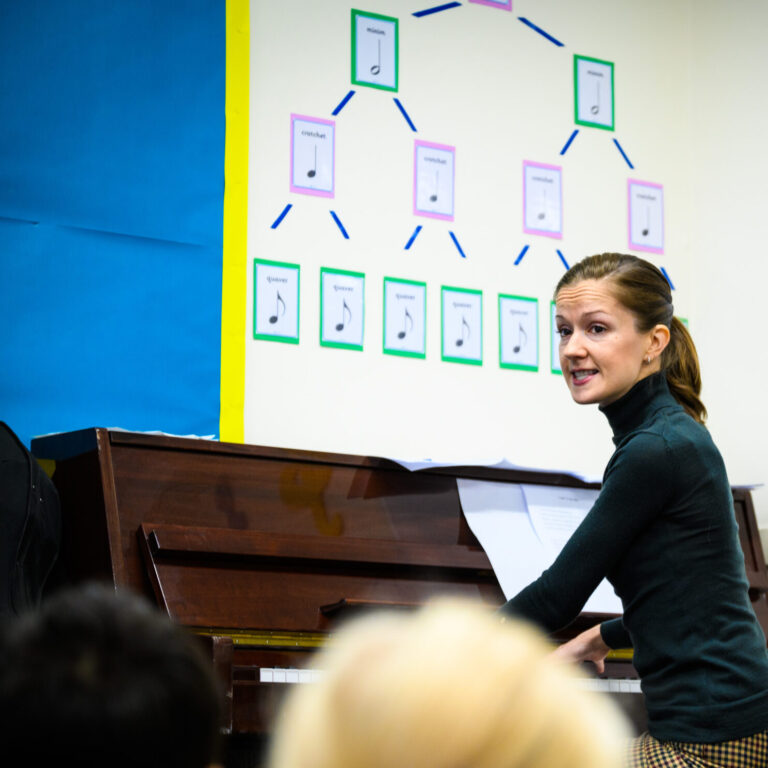 teacher playing the piano